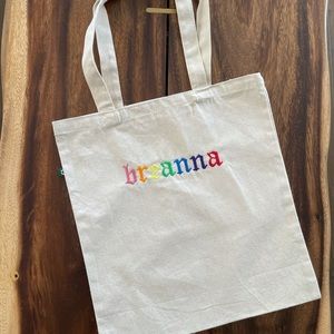 Custom tote bag with embroidered name.